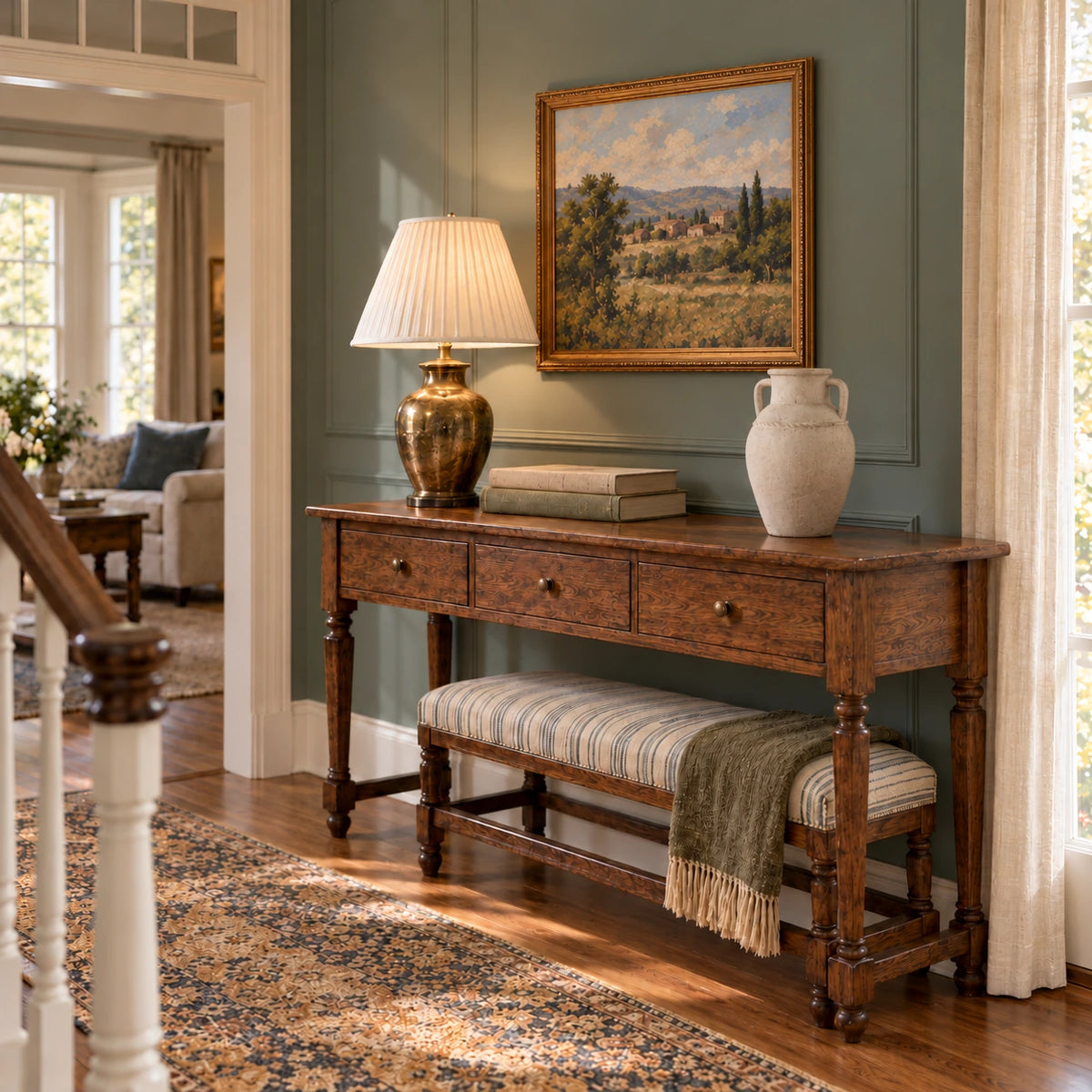 Empty textured beige vase on an oak console with a brass lamp in a furnished townhouse entry