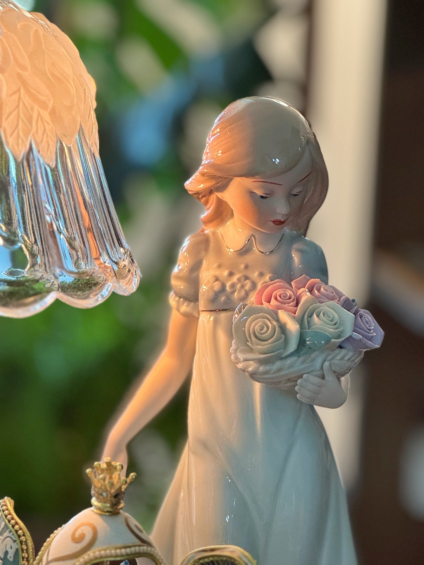 Ceramic figurine of a woman holding flowers with a blurred background