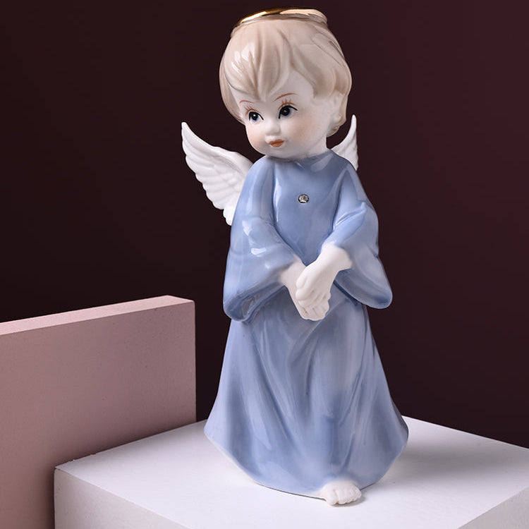Ceramic angel figurine with a dark brown background