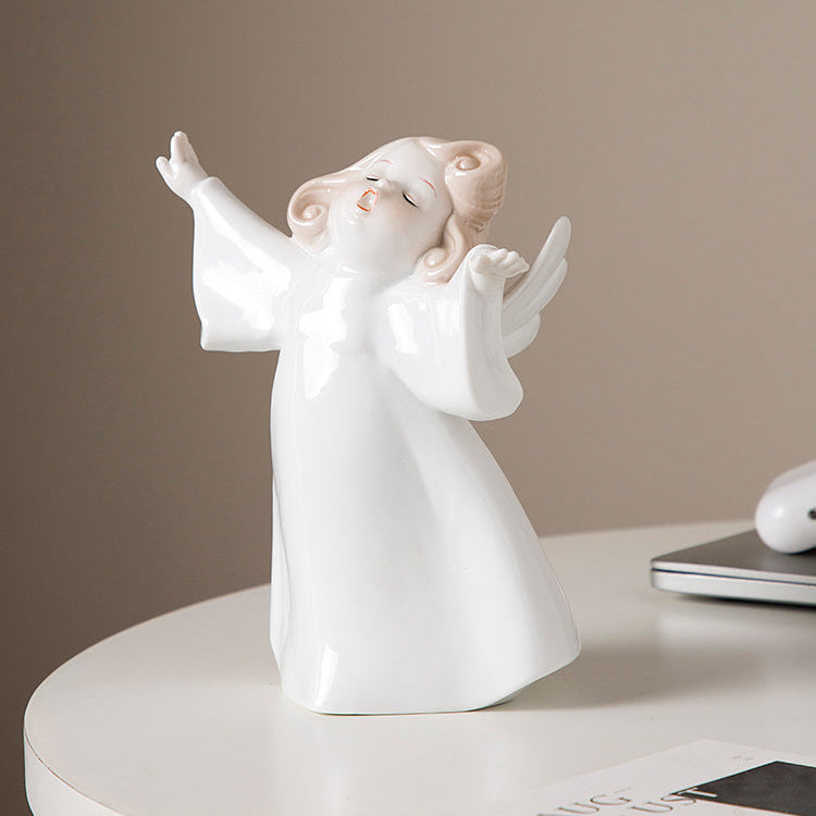 White angel figurine on a round white surface with a beige background