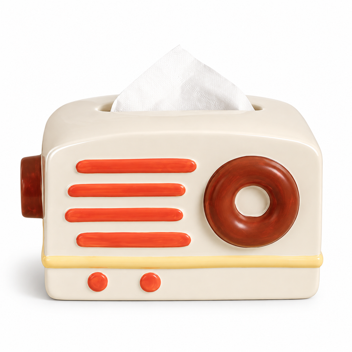 Cremefarbene Keramik-Taschentuchbox in Radioform mit vier korallfarbenen Leisten und braunem Rundknopf.