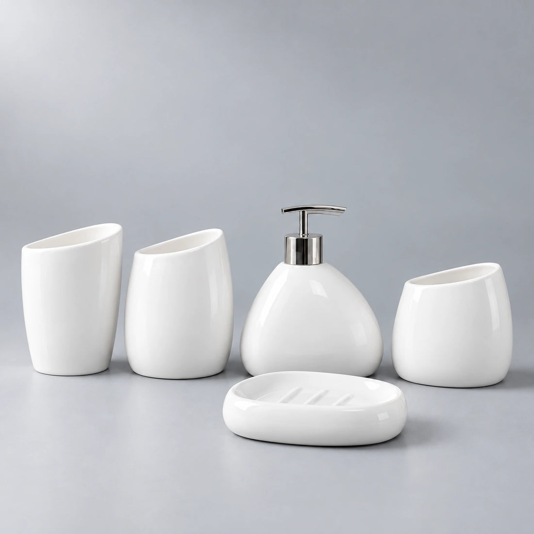 Arc White five-piece ceramic bathroom set with two cups, holder, pump dispenser and soap dish.