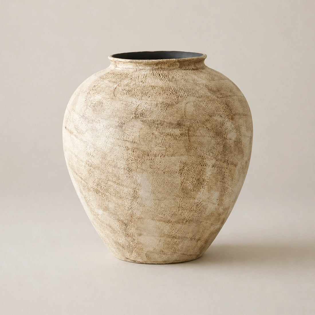 Large stone-textured ivory ceramic vase with taupe mottling on a neutral greige background.