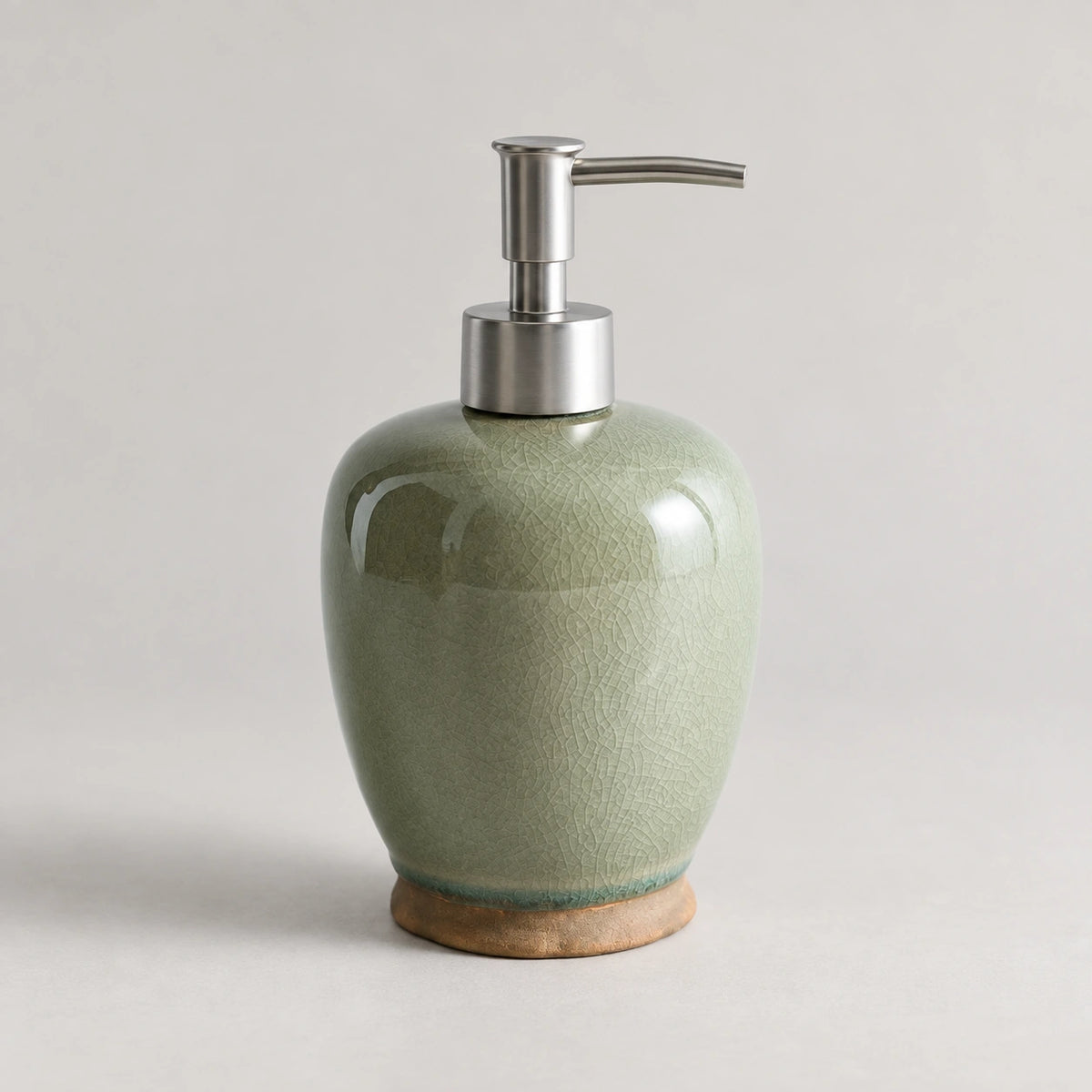 Willow Sage ceramic soap dispenser with green crackle glaze, a silver-tone pump and a brown base.
