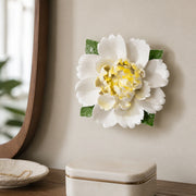 Extra Large Ruffled Peony Ceramic Wall Flower in Golden Yellow Accent mounted above a lidded jewelry box in a dressing area.