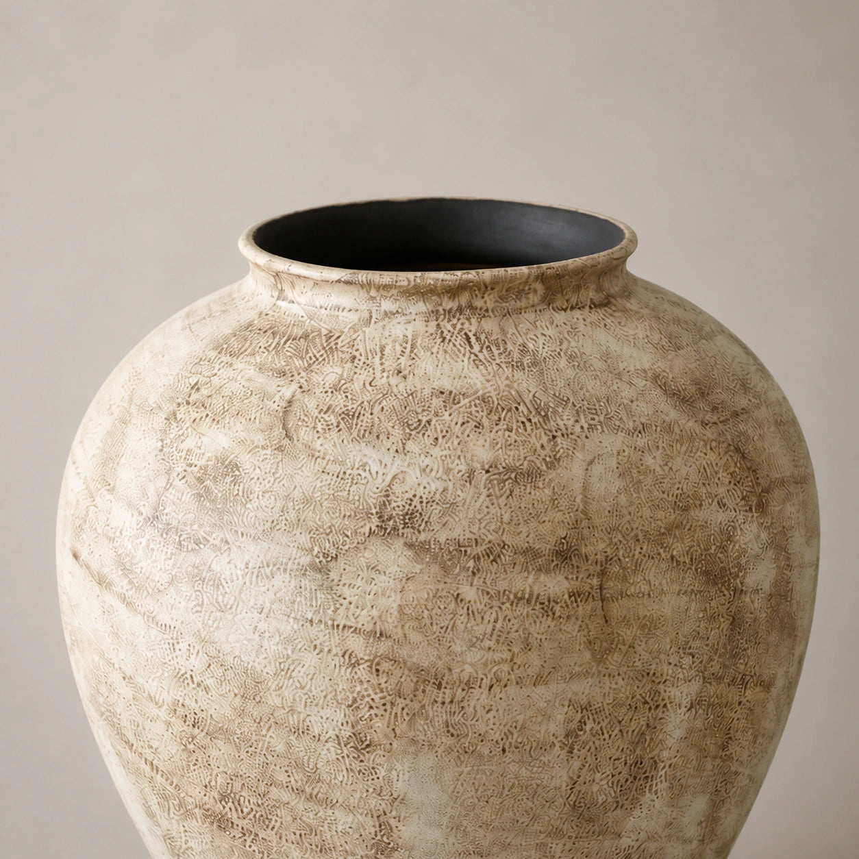 Close view of the Large vase's rounded lip, dark opening, granular ceramic surface, and taupe mottling.