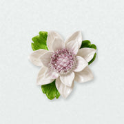 Medium Lotus Bloom Ceramic Wall Flower in Plum Purple Accent on a pale neutral studio wall.