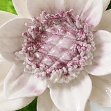Close view of the plum purple accent center and glazed petals on Medium Lotus Bloom Ceramic Wall Flower.