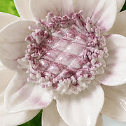 Close view of the plum purple accent center and glazed petals on Medium Lotus Bloom Ceramic Wall Flower.