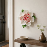 Medium Ruffled Peony Ceramic Wall Flower in Rose Red Accent mounted above a narrow catchall shelf in an apartment foyer.