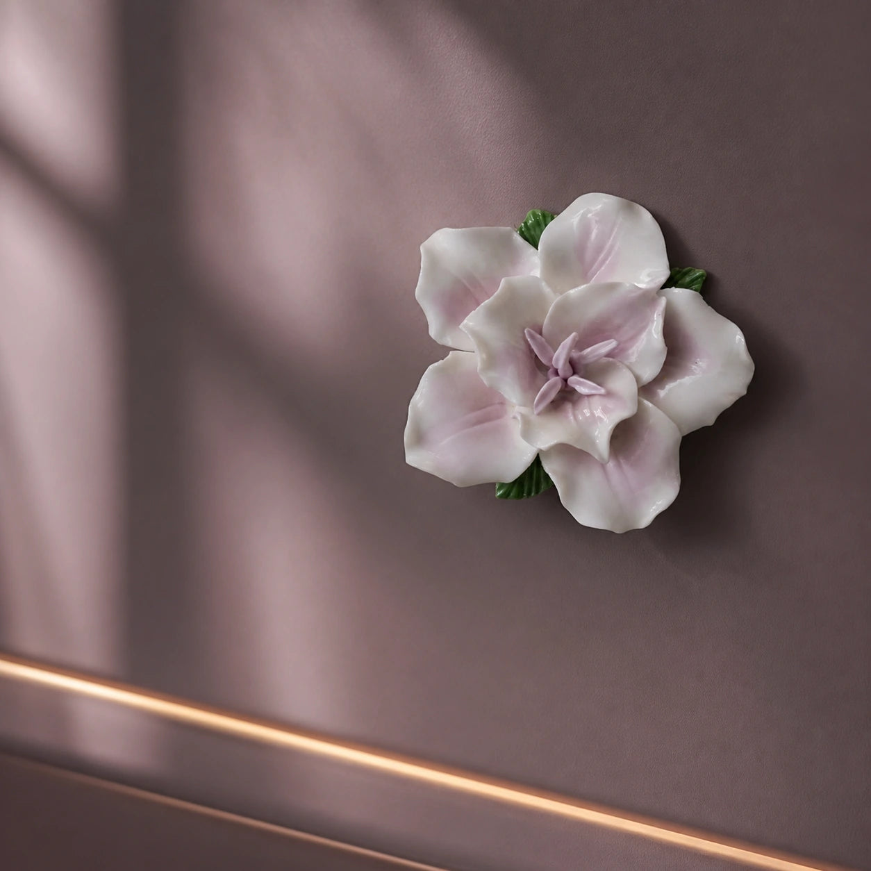 Soft lavender ceramic lily magnet styled on a smoky mauve magnetic cabinet at blue hour.