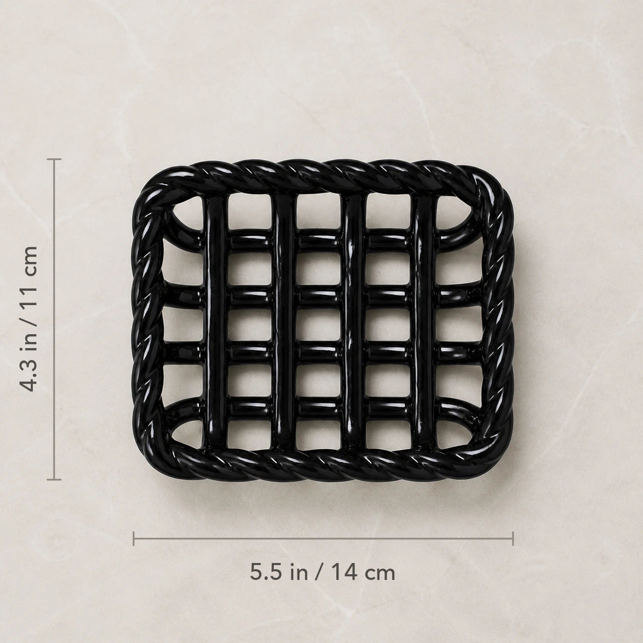 Top view of the Glossy Noir soap basket marked 5.5 by 4.3 inches