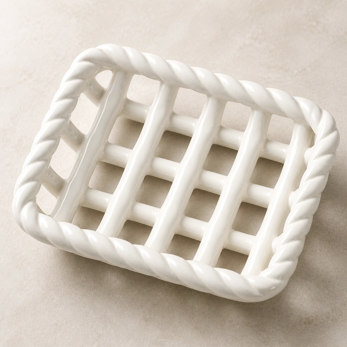 Close view of the glossy white braided rim and open ceramic lattice