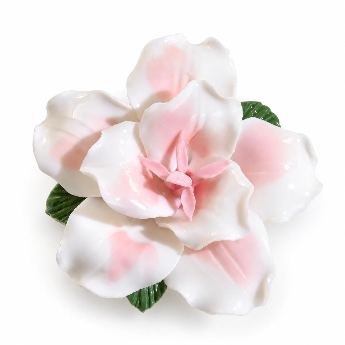 Blush Pink ceramic lily fridge magnet with green leaves on a white background.