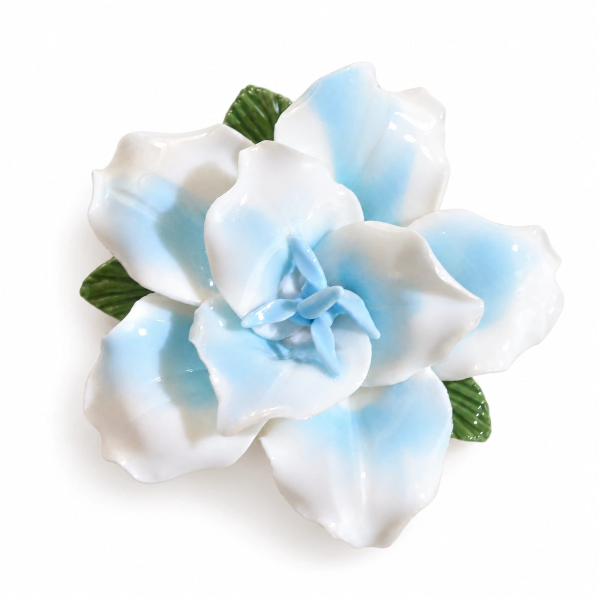 Powder Blue ceramic lily fridge magnet with green leaves on a white background.