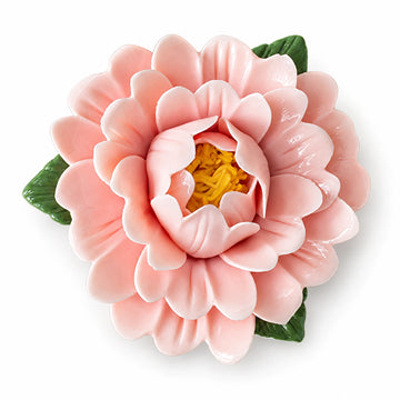 Blush Pink ceramic peony fridge magnet with green leaves on a white background.