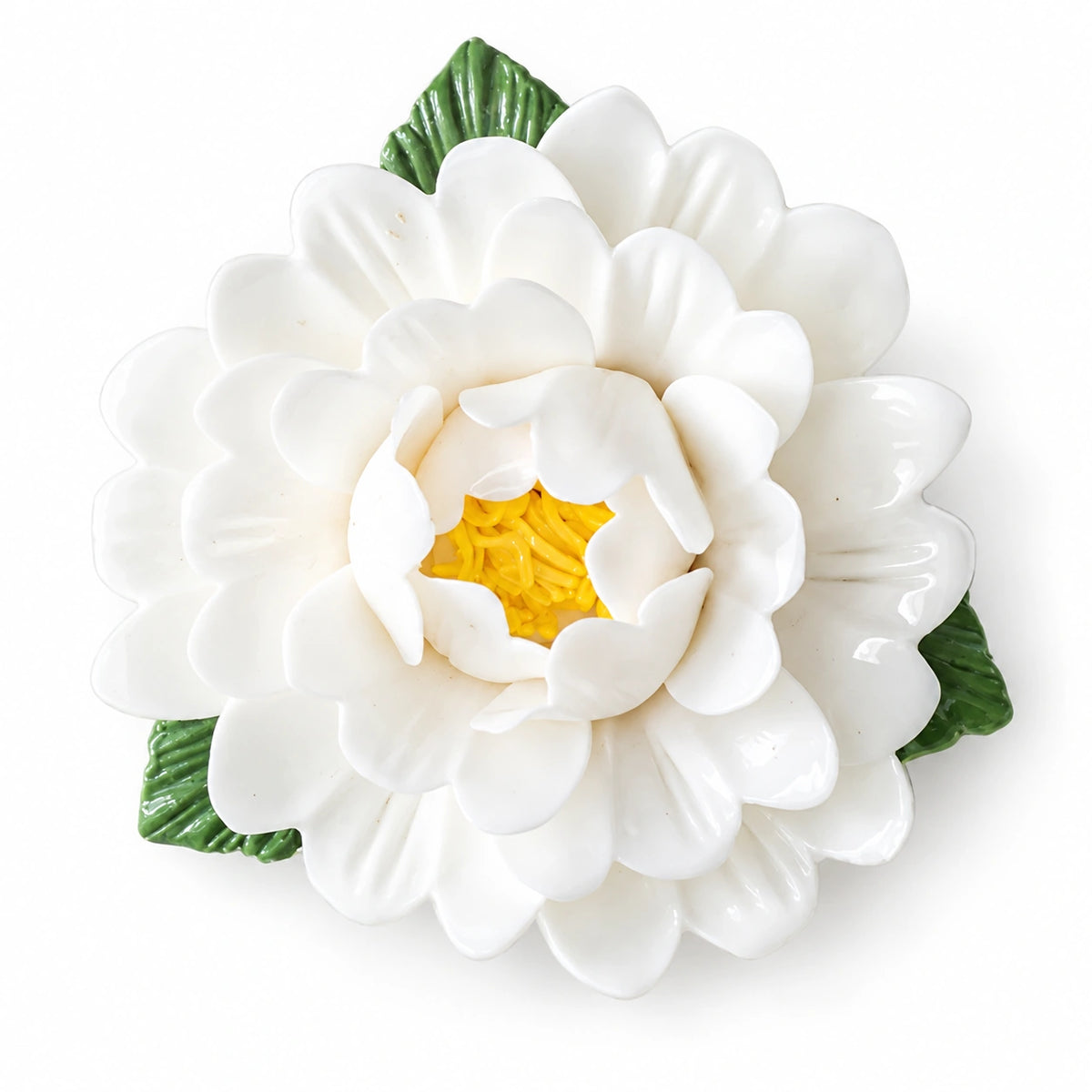 Warm White ceramic peony fridge magnet with green leaves on a white background.