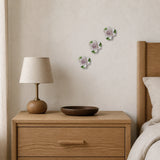 7 cm Small Lotus Bloom ceramic wall flower with plum purple accent styled in a warm neutral interior.