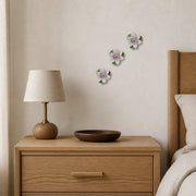7 cm Small Lotus Bloom ceramic wall flower with plum purple accent styled in a warm neutral interior.