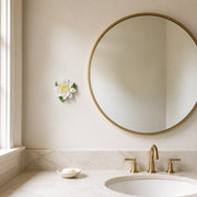 12 cm Large Lotus Bloom ceramic wall flower with golden yellow accent styled in a warm neutral interior.