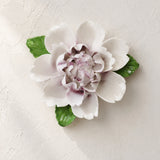 Front view of the Large Ruffled Peony ceramic wall flower with plum purple accent.