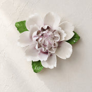 Front view of the Large Ruffled Peony ceramic wall flower with plum purple accent.
