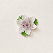Front view of the Small Lotus Bloom ceramic wall flower with plum purple accent.