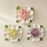 Extra Large Ruffled Peony ceramic wall flowers with golden yellow, plum purple and rose red accents arranged together on a warm neutral wall.
