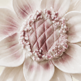 Close frontal view of the plum purple center and layered glazed petals of the Large Lotus Bloom ceramic wall flower.