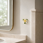 7 cm Small Lotus Bloom ceramic wall flower with golden yellow accent styled in a warm neutral interior.
