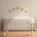 9 cm Medium Lotus Bloom ceramic wall flower with golden yellow accent styled in a warm neutral interior.