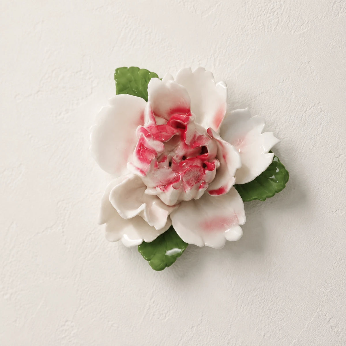 Front view of the Small Ruffled Peony ceramic wall flower with rose red accent.