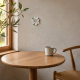 9 cm Medium Lotus Bloom ceramic wall flower with plum purple accent styled in a warm neutral interior.