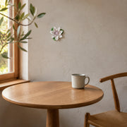 9 cm Medium Lotus Bloom ceramic wall flower with plum purple accent styled in a warm neutral interior.