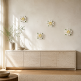 Multiple 15 cm Extra Large Ruffled Peony ceramic wall flowers with golden yellow accent arranged as a wall grouping in a warm neutral interior.