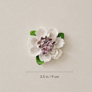 Dimension image for the Medium Ruffled Peony ceramic wall flower with plum purple accent, showing a 3.5 in / 9 cm diameter.