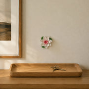 9 cm Medium Lotus Bloom ceramic wall flower with rose red accent styled in a warm neutral interior.