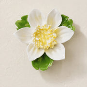 Front view of the Small Lotus Bloom ceramic wall flower with golden yellow accent.