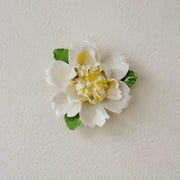 Front view of the Medium Ruffled Peony ceramic wall flower with golden yellow accent.