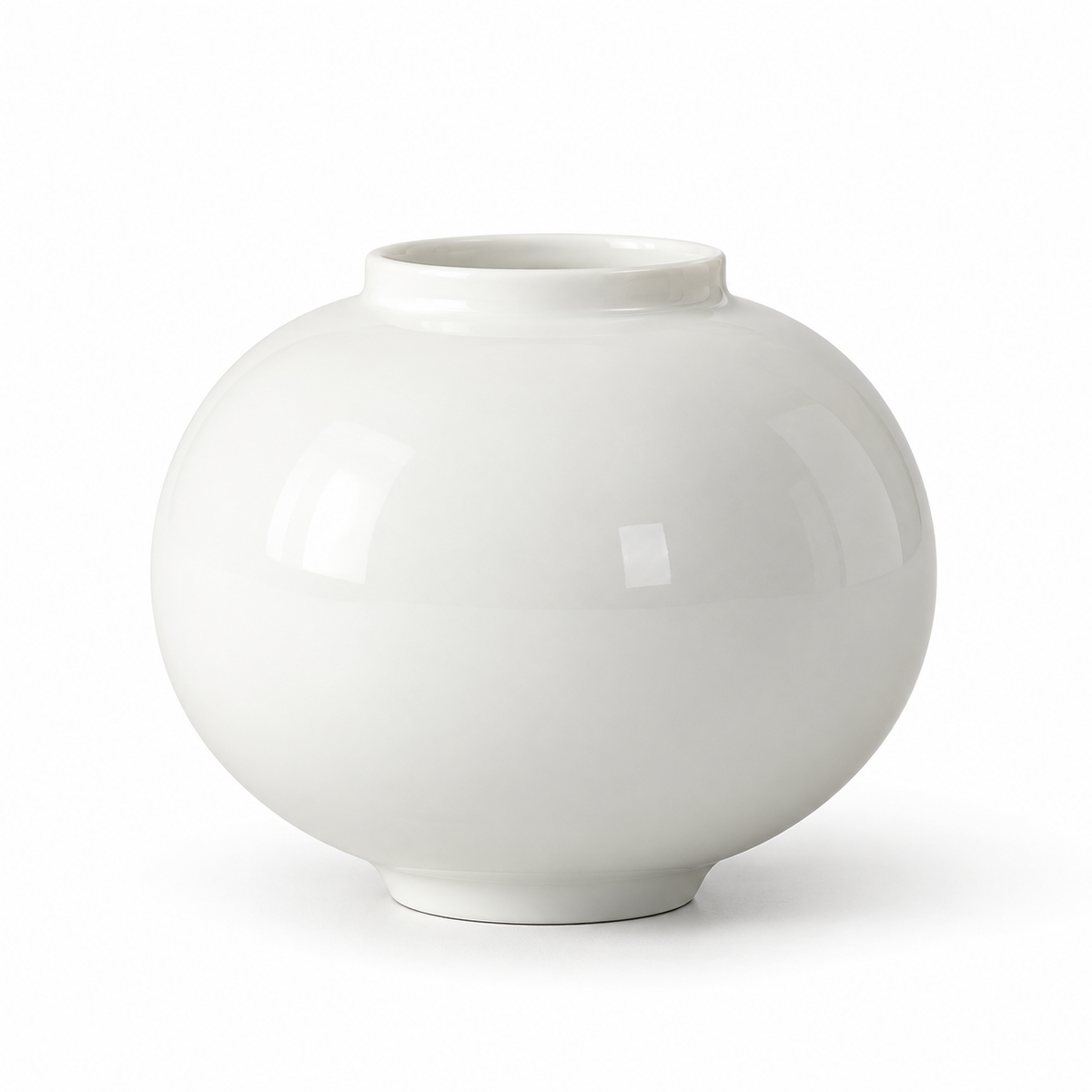 Small glossy white moon ceramic vase on a white studio background.