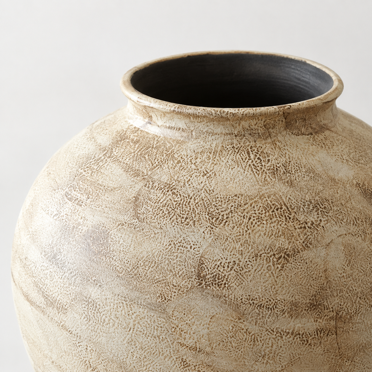 Small stone-textured ivory ceramic vase: rolled rim and mottled ceramic surface.