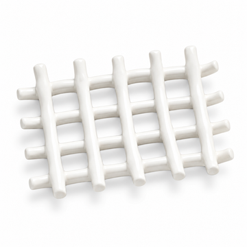 White ceramic soap dish formed from intersecting branch-like rods.