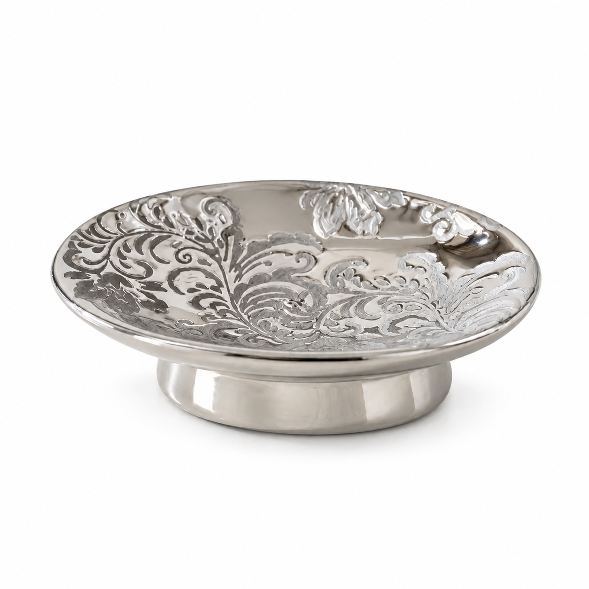Silver-toned round ceramic dish with an ornate floral pattern and a short pedestal base.