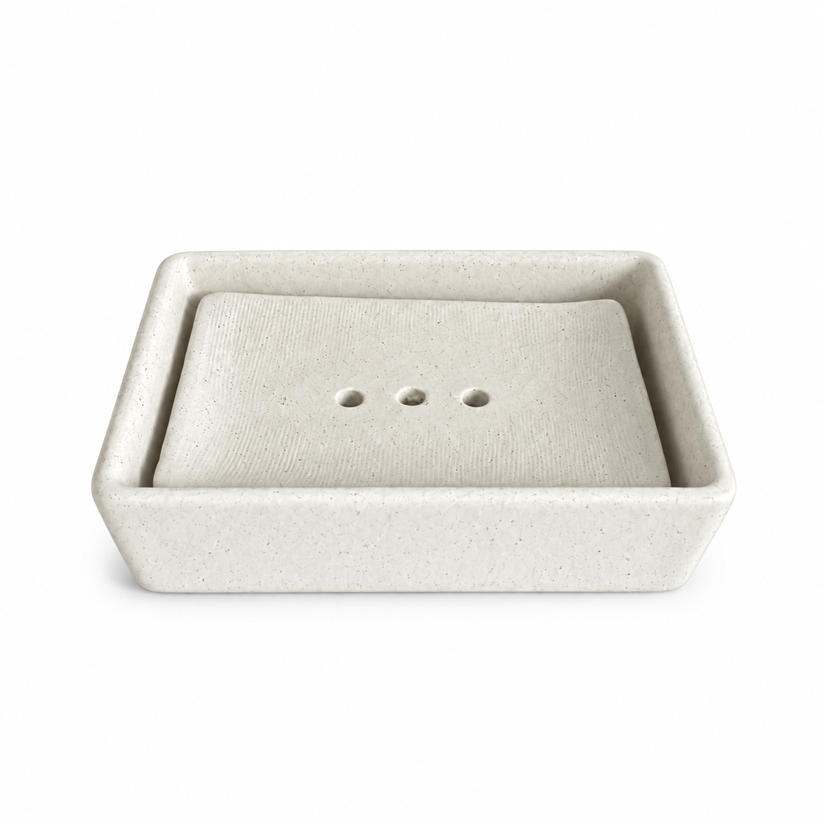 Pale ivory speckled ceramic soap dish with a removable rectangular insert and three drainage holes.
