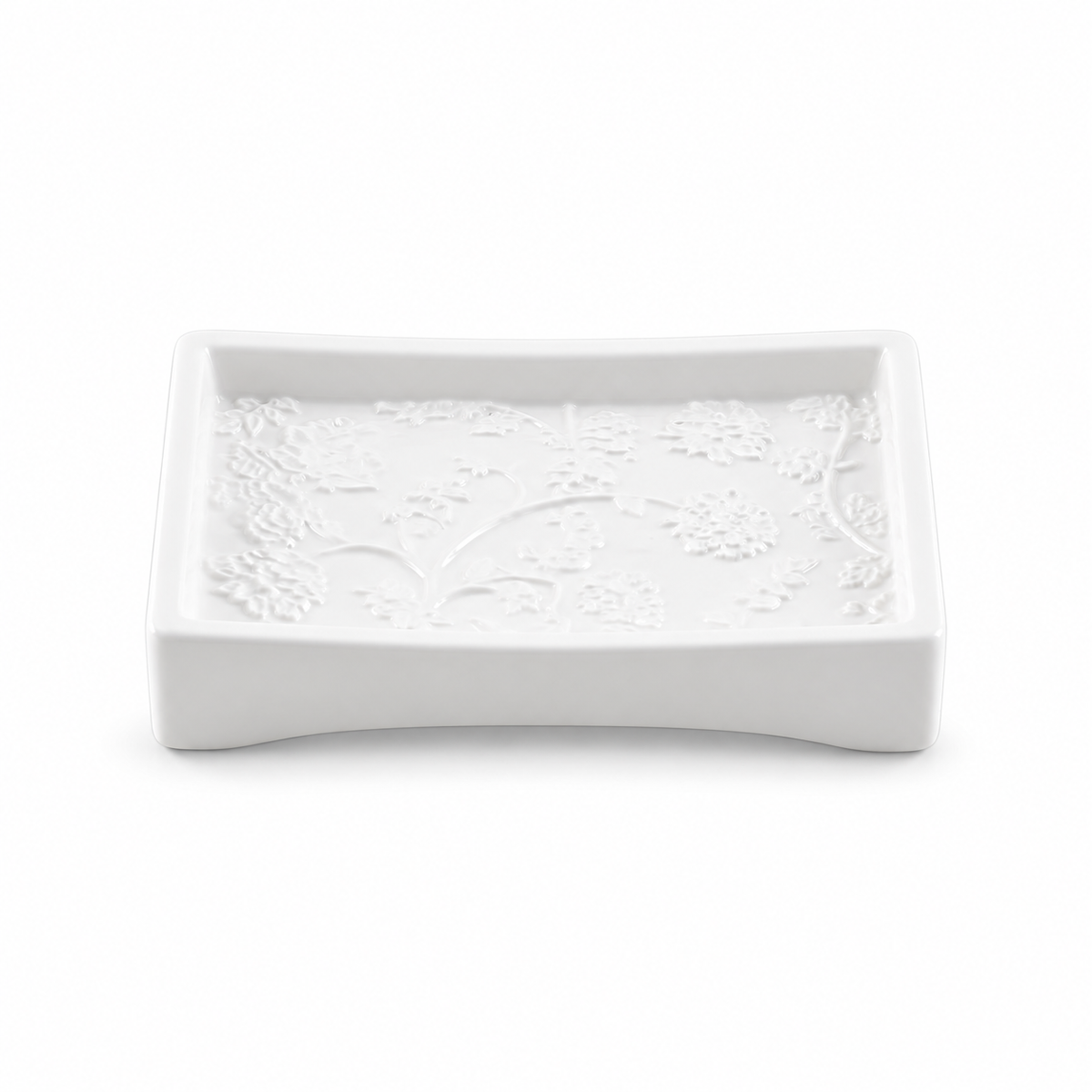 White curved rectangular ceramic soap dish with raised botanical detail.