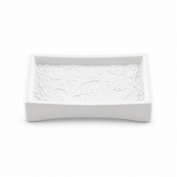White curved rectangular ceramic soap dish with raised botanical detail.