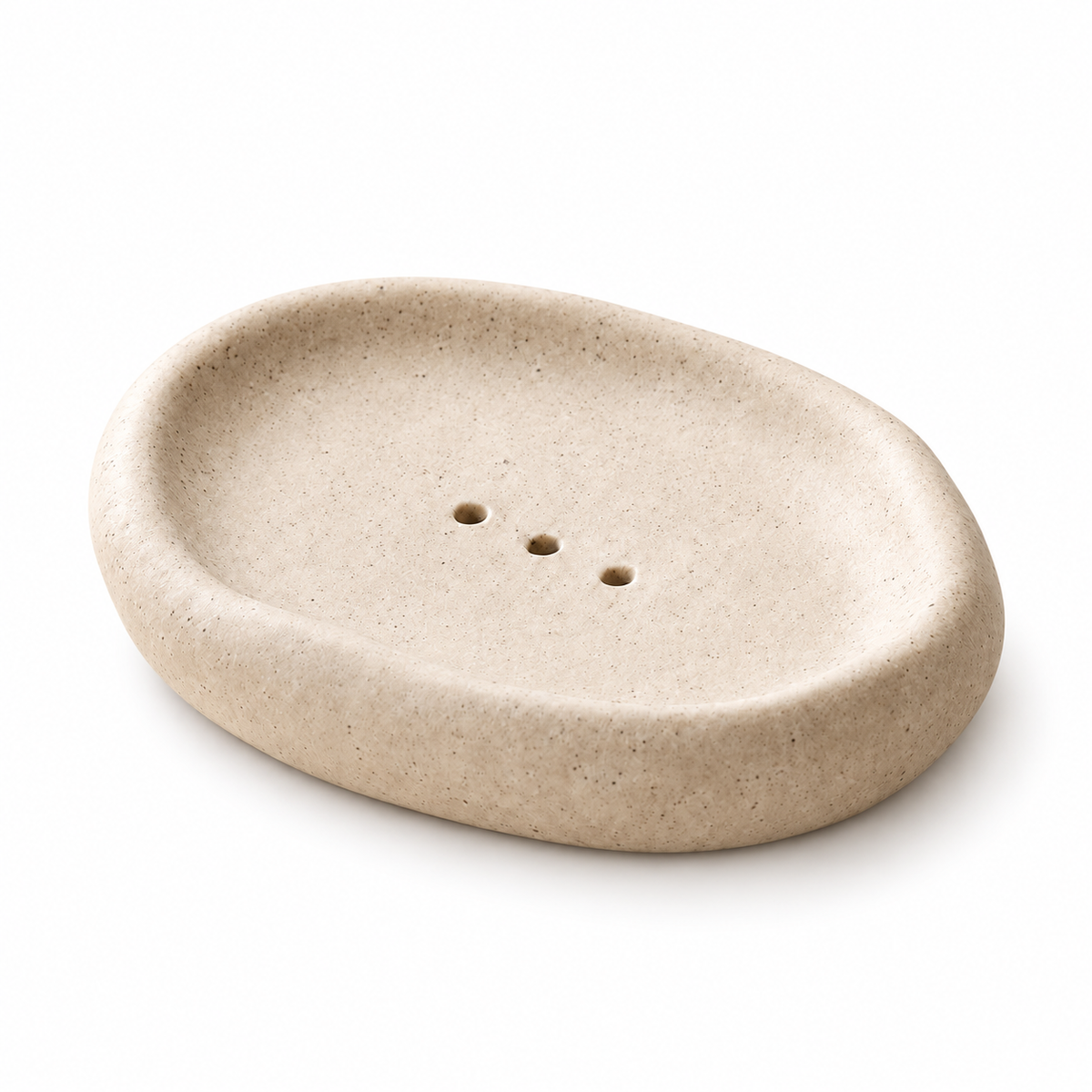Warmbeige Keramik-Seifenschale in Kieselform mit dickem Rand und drei Ablauflöchern.