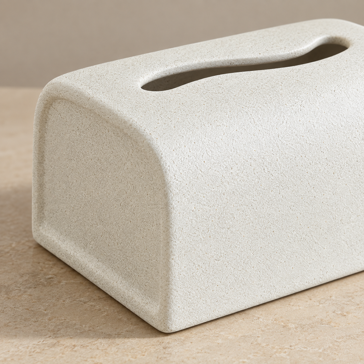 Close view of the fine granular finish, recessed arched end panel and wavy dispensing opening.