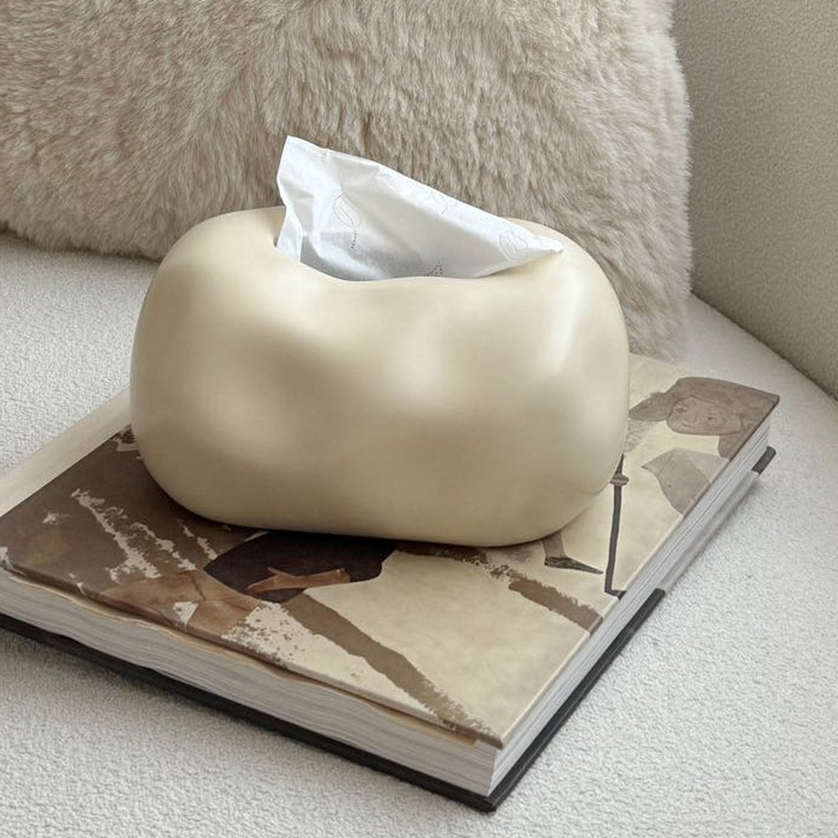 Original close view of the beige ceramic bubble surface and top tissue opening.