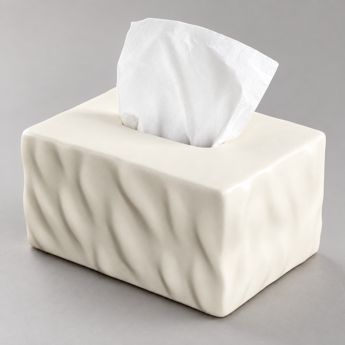 Close view of the Warm Ecru tissue box cover showing its folded front, rounded corner and top opening.